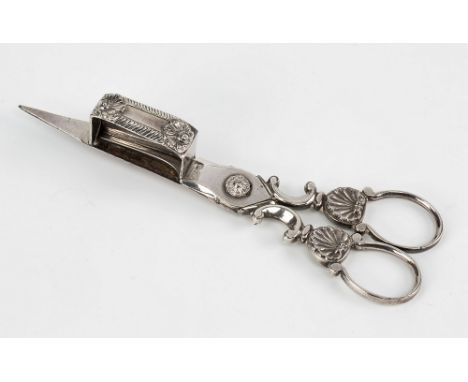 A pair of Continental candle snuffers with wick trimmer horse shoe ring handles above shell and C scroll neck, snuff box with