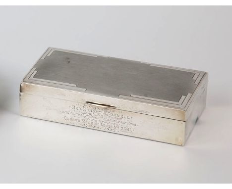 An Art Deco silver cigarette case Sanders & Mackenzie, Birmingham 1937, rectangular with engine turned decoration and engrave