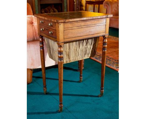 An early 19th century ebony strung mahogany games / work table the rectangular top with sliding insert with inset leather, re