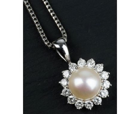 A Mappin & Webb 18ct white gold, pearl and diamond pendant the single 8mm. cultured pearl within a floral border of fourteen 