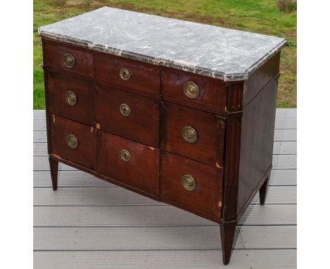 A 19th century French mahogany three drawer commode in the transitional style, with grey marble top and three crossbanded gra