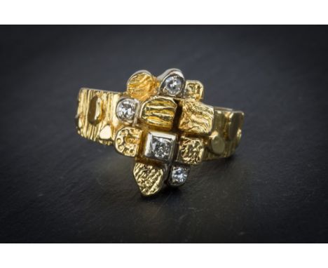 A modernist style 18ct yellow gold and diamond ring London 1970, the cobbled effect ring set with four graduated brilliant cu