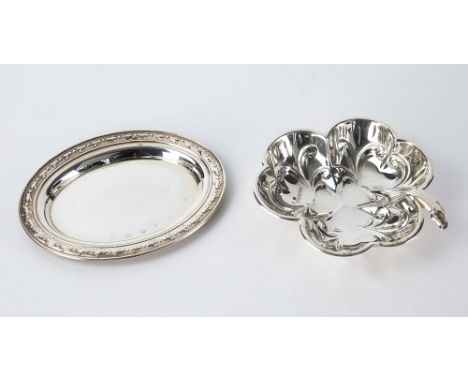 An Elizabeth II silver clover leaf pin tray Mappin & Webb, Sheffield 1989; together with an oval pin tray with husk and bead 