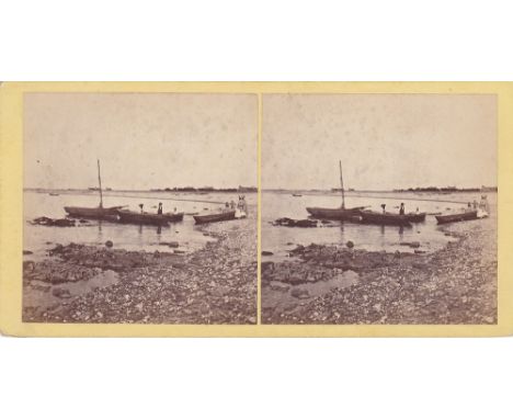 A Guernsey interest stereoview card depicting figures and vessels at low tide on Cobo Bay, by T. B. Hutton, pasted title vers
