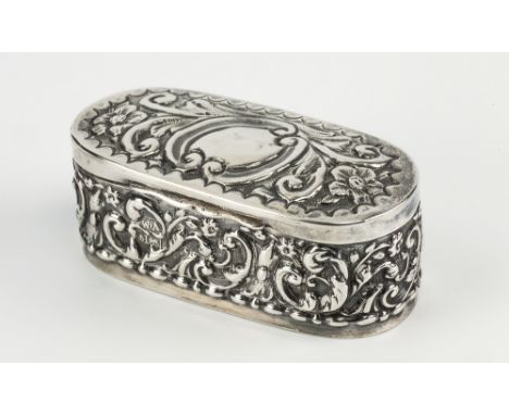 An Edwardian silver pill box William Aitken, Birmingham 1903, rounded rectangular form with repousse scroll work decoration, 