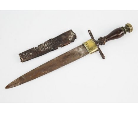 A Scottish Dirk possibly 18th century, turned wooden grip with brass finial, crossbar guard, with remains of leather scabbard