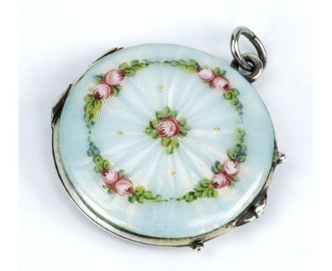 A silver and floral guilloche locket hinged counter form, the front decorated with floral garlands to the outer edge, a singl