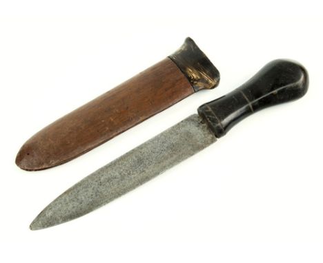 An early 20th century African tribal dagger waisted form horn handle into broad steel blade, dark hardwood scabbard with horn