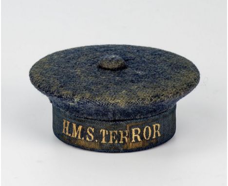 A very rare novelty sailors cap travelling inkwell the metal hat covered in navy blue felt with ‘HMS Terror’ Royal Navy aroun