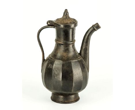 An unusual cast iron Russian coffee pot 19th century, ovoid body with thick vertical facets, hinged flared dome lid with peta