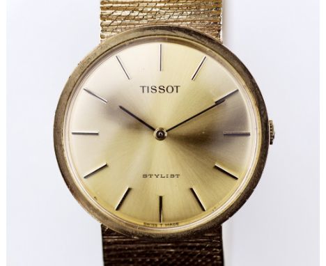 A 9ct gold Tissot gentleman's wrist watch the 27mm. brushed gold dial with gilt baton numerals, signed 'Tissot Stylist Swiss 