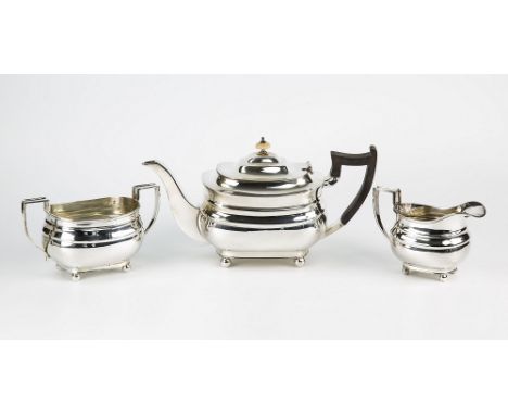 A George V silver three piece silver tea set William Hutton & Sons, Sheffield 1931, of Georgian bombe form, with angular hand