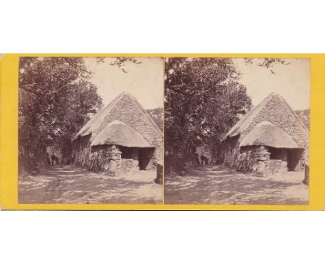 A Guernsey stereoview card depicting a thatched outbuilding situated in a track by the Gouffre, by T. B. Hutton, pasted title