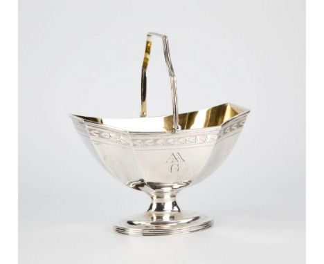 A good George III silver swing handled sugar basin Joseph Scammell, London 1795, of octagonal boat form with engraved foliate