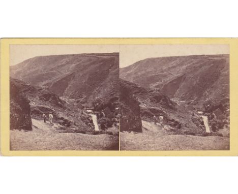A Channel Islands stereoview card two figures over-looking Petit Bot Bay, Guernsey, by T. B. Hutton, paste title verso.