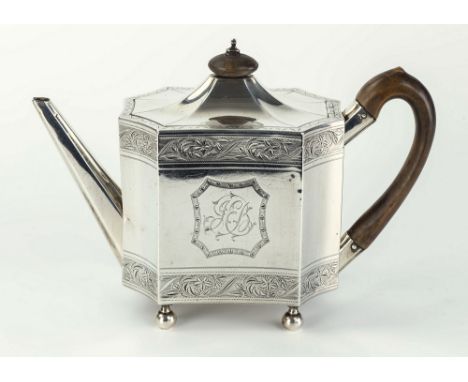 A George lll silver teapot Henry Chawner, London 1792, the shallow domed lid with wooden finial above a shaped body with foli