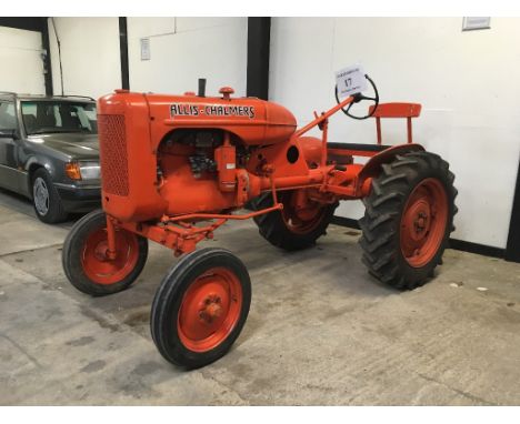A 1947 Allis Chalmers B tractor, orange.  Having been in dry storage for a number of years this vintage tractor will require 