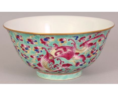 A CHINESE FAMILLE ROSE PORCELAIN BOWL, decorated with phoenix, flaming pearls and cloud scrolls reserved on a turquoise groun