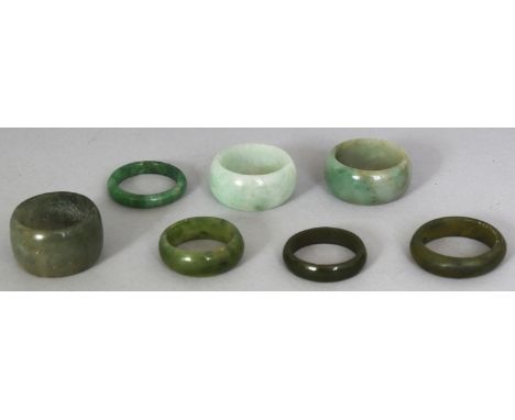 A GROUP OF SEVEN CHINESE JADE RINGS, various sizes. (7)