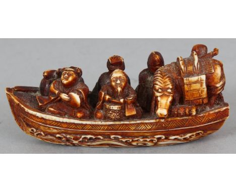 A SIGNED IVORY-STYLE NETSUKE, in the form of four of the Lucky Gods, an oarsman and a horse, all travelling in a river boat, 