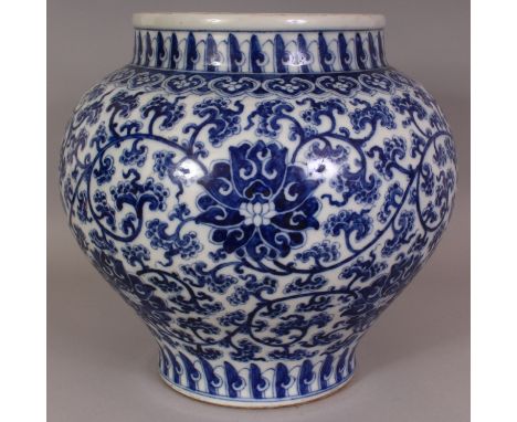 A LARGE CHINESE BLUE & WHITE PORCELAIN LOTUS JAR, the sides decorated with a formal design of scrolling lotus, the base with 