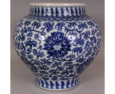 A LARGE CHINESE BLUE & WHITE PORCELAIN LOTUS JAR, the sides decorated with a formal design of scrolling lotus, the base with 