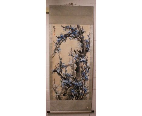 A CHINESE HANGING SCROLL PICTURE, decorated with branches of blue blossom, and with an inscription and an artist's seal, the 