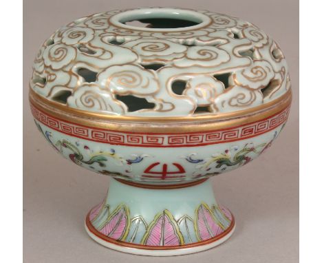 A CHINESE CELADON GROUND FAMILLE ROSE PORCELAIN CENSER & COVER, the cover pierced with cloud scrolls, the sides of the censer