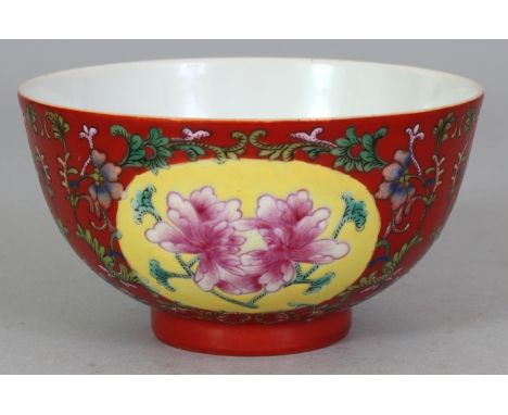 A FINE QUALITY CHINESE RUBY GROUND FAMILLE ROSE PORCELAIN BOWL, the sides decorated with yellow ground floral ovals reserved 