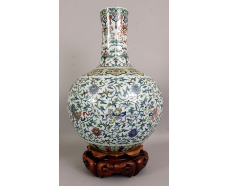 A LARGE GOOD QUALITY CHINESE DOUCAI PORCELAIN BOTTLE VASE, together with a fitted wood stand, the sides decorated with formal