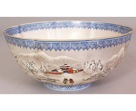 A 20TH CENTURY CHINESE EGGSHELL PORCELAIN BOWL, of lobed octofoil form, the sides decorated with a continuous winter river la