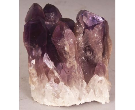 A SECTION OF NATURAL AMETHYST, 3.25in high.