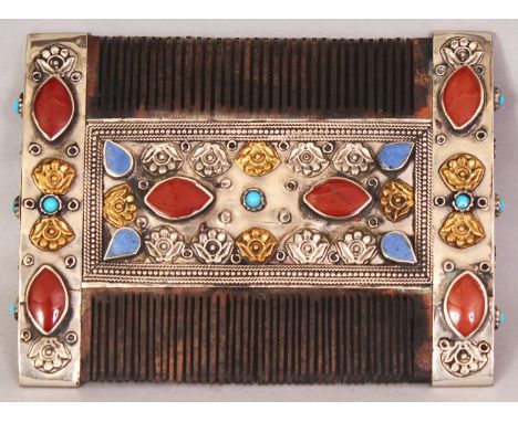 AN UNUSUAL EASTERN STONE INLAID & SILVER-METAL ONLAID WOOD COMB, 3.75in wide x 2.8in.