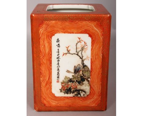 A CHINESE REPUBLIC STYLE SQUARE SECTION PORCELAIN BRUSHPOT, the panels reserved on an iron-red wood-grained ground, the base 