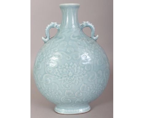 A CHINESE CLAIRE-DE-LUNE PORCELAIN MOON FLASK, the sides moulded beneath the glaze with scroll-stemmed lotus, the base with a