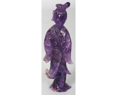 A CHINESE CARVED AMETHYST FIGURE OF GUANYIN, 4.4in high.