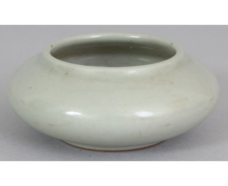 A CHINESE CELADON PORCELAIN BRUSHWASHER, the base with a Qianlong seal mark, 3.5in wide.