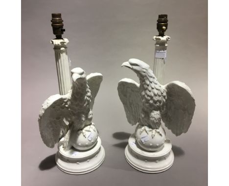 A pair of Italian pottery lamp bases, modelled as eagles