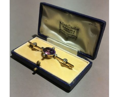 An antique amethyst and diamond bar brooch