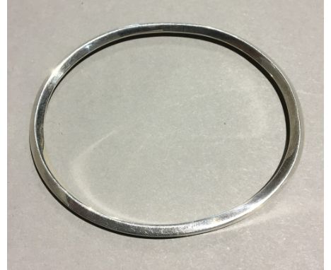 A silver bangle (20.4 grammes)