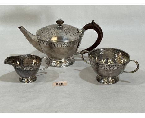 A George V silver three piece tea service by Liberty &amp; Co, comprising teapot, cream jug and sucrier. Birmingham 1918. 25o