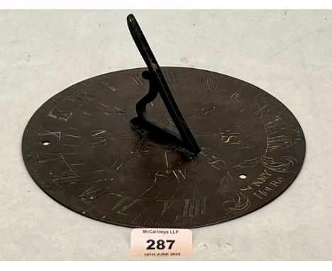 An antique bronze sundial. 8" diameter
