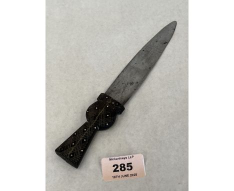 An antique Scottish dagger, the thistle shaped handle steel nail engraved and diaper carved. 8" long