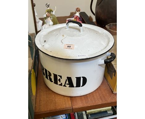 An enamel bread bin and cover. 12" diameter