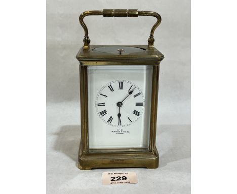 A brass carriage clock, the repeat movement striking the hours and half hours on a coiled steel gong. 5¼" high. In running or