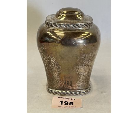 A Victorian silver tea caddy. Birmingham 1898. 4¼" high. 6ozs 18dwts. Dents