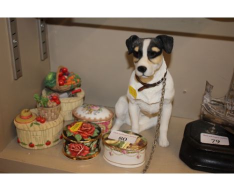 A dog ornament and five small trinket boxes and covers 