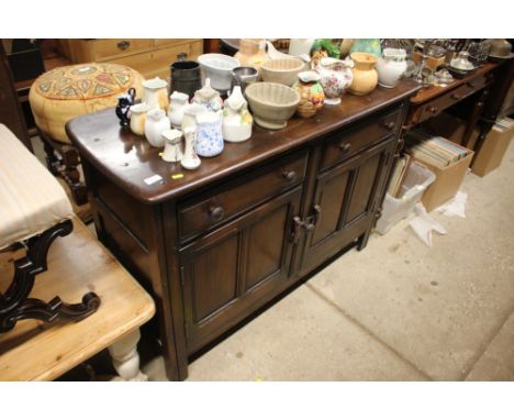 An Ercol sideboard fitted two drawers