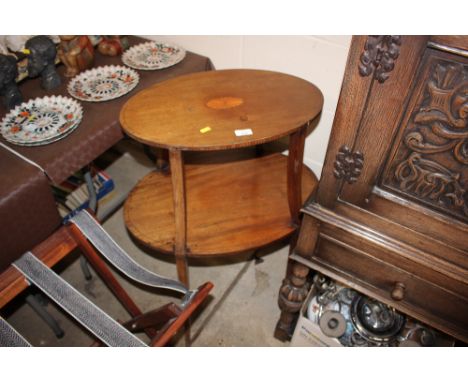 An Edwardian mahogany and inlaid two tier etegere