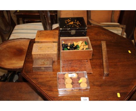 A box of chess pieces, draughts pieces, various decorative trinket boxes etc.